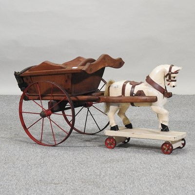 Lot 56 - A 20th century children's pull-along model horse and cart