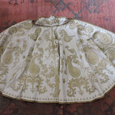 Lot 190 - A cape or short cloak, richly embroidered with gold coloured thread