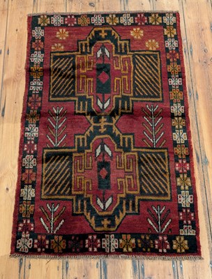 Lot 511 - A Baluchi rug