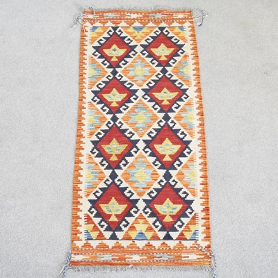 Lot 442 - A Persian kilim runner, with two rows of...