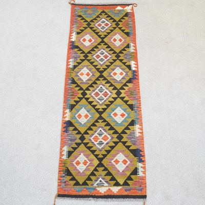 Lot 195 - A Persian kilim runner, with coloured diamonds,...