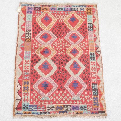 Lot 296 - A baluchi rug, with two rows of diamonds, on a...