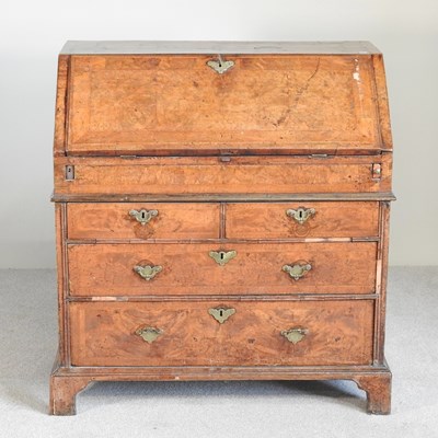 Lot 358 - A George I walnut and crossbanded bureau, the...