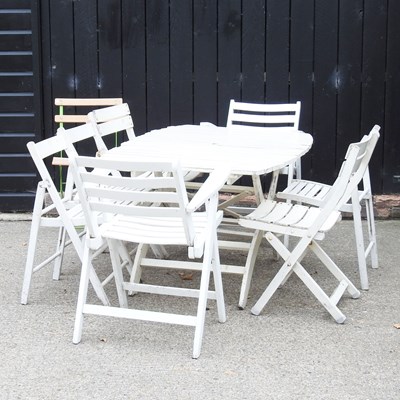 Lot 325 - A white painted folding garden table, together...