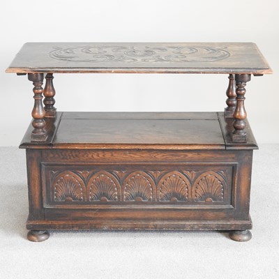 Lot 248 - An early 20th century carved oak monk's bench