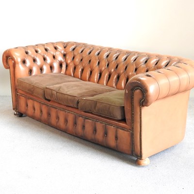 Lot 172 - A brown leather button back chesterfield sofa,...