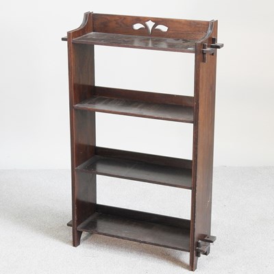 Lot 532 - An Arts and Crafts oak open bookcase