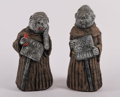 Lot 668 - A pair of reconstituted stone garden figures...