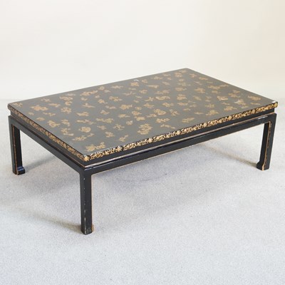 Lot 539 - A modern ebonised and gilt decorated coffee table