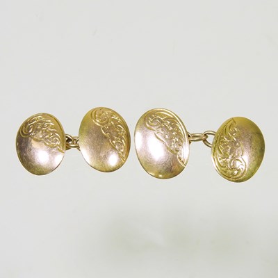 Lot 80 - A pair of 9 carat gold cufflinks, each of oval...