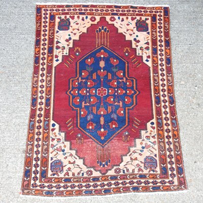 Lot 212 - A woollen prayer rug, with geometric designs,...