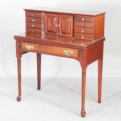 Lot 186 - A reproduction cherrywood writing desk, with a...