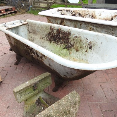 Lot 451 - An antique cast iron roll top bath