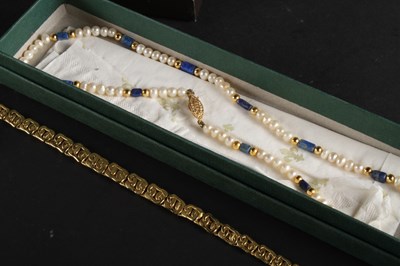 Lot 91 - A Gucci gold plated ladies dress wristwatch,...