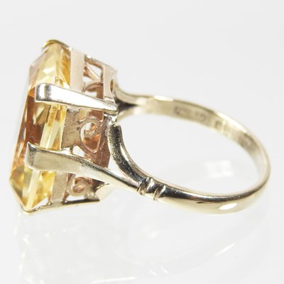 Lot 28 - A large 9 carat topaz cushion cut dress ring,...