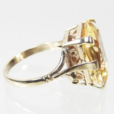 Lot 28 - A large 9 carat topaz cushion cut dress ring,...