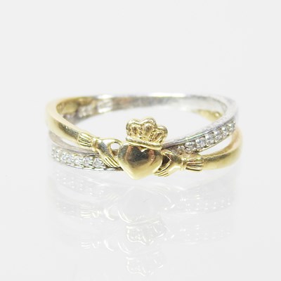 Lot 528 - A 9 carat gold and silver Claddagh style...