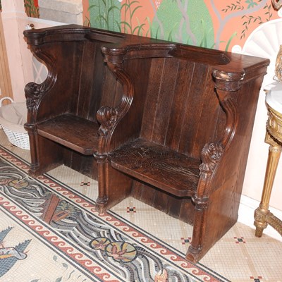 Lot 31 - A 19th century carved oak church pew