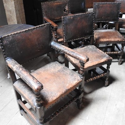 Lot 32 - A set of six oak and studded leather dining chairs