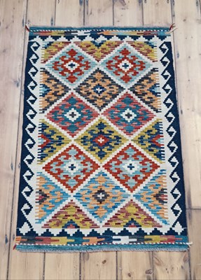 Lot 250 - A Persian kilim rug, with all over coloured...