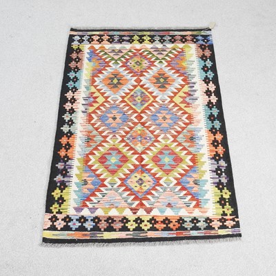 Lot 749 - A kilim rug, with coloured lozenges, 148 x 102cm