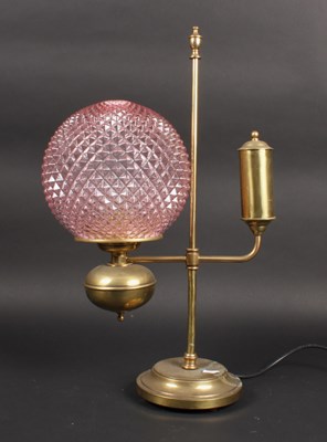 Lot 151 - A brass student's lamp, with a pink hobnail...
