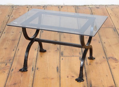 Lot 600 - A black painted iron side/coffee table, with a...