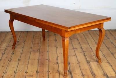 Lot 582 - An Italian walnut extending dining table,...