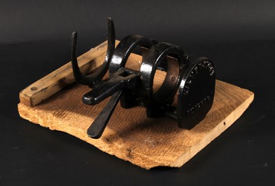 Lot 654 - A Kilverstone wall-mounted cast iron asparagus...