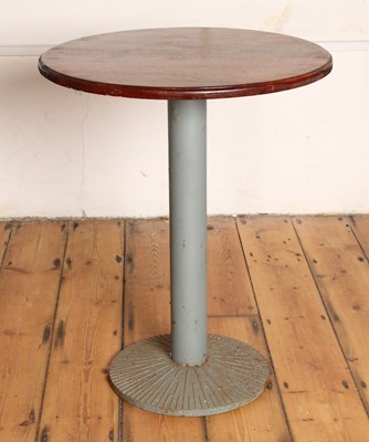 Lot 612 - A wooden café table, on a single steel support