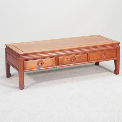 Lot 143 - A Chinese hardwood coffee table, containing a...