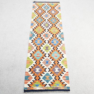 Lot 528 - A Persian kilim runner, with all over coloured...