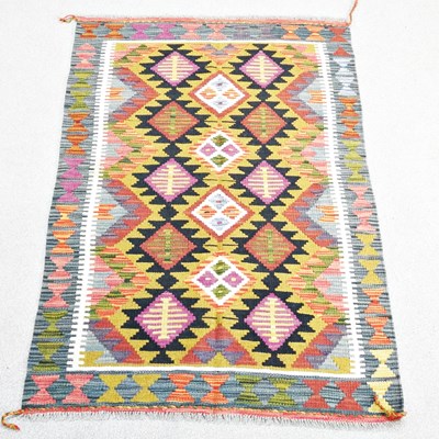 Lot 518 - A Persian kilim rug, with three rows of...