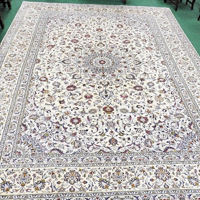 Lot 615 - A large Persian kashan carpet, with foliate...