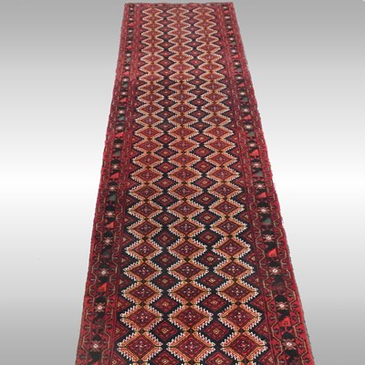 Lot 294 - A Persian Meshed runner, with rows of diamonds,...