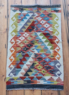 Lot 674 - A Chobi Kilim rug, with geometric decoration,...