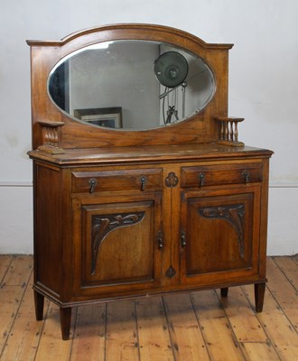 Lot 611 - An early 20th century oak mirror back sideboard