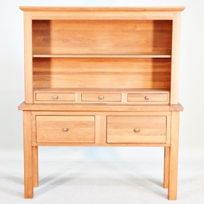 Lot 406 - A modern light oak dresser, on square legs