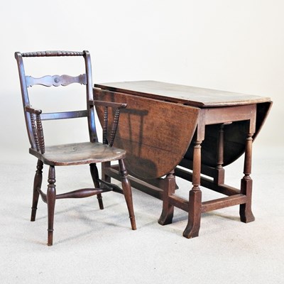 Lot 261 - An 18th century oak gateleg dining table, with...