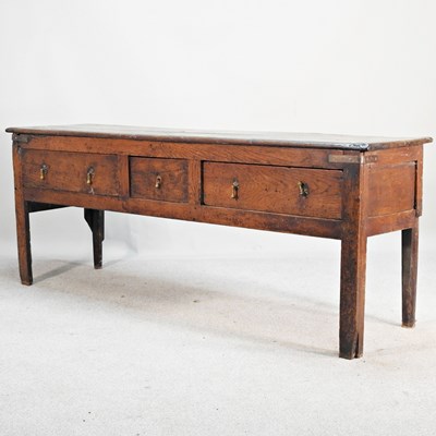 Lot 638 - An 18th century oak dresser base, containing...
