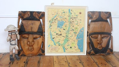 Lot 713 - A pair of Nigerian carved wood wall masks,...