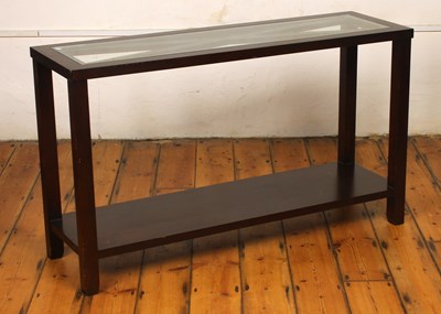 Lot 678 - A modern teak two-tier glass topped hall or...