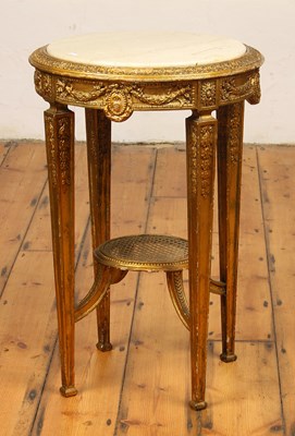 Lot 589 - A neoclassical style giltwood circular marble...