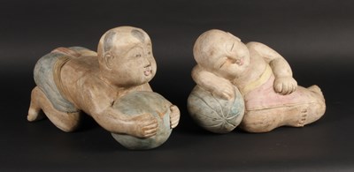 Lot 601 - Two Chinese carved wood figures of children