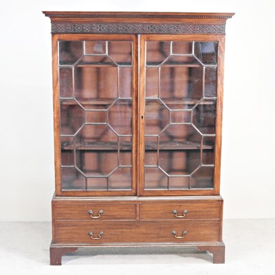 Lot 672 - An early 20th century mahogany glazed bookcase,...