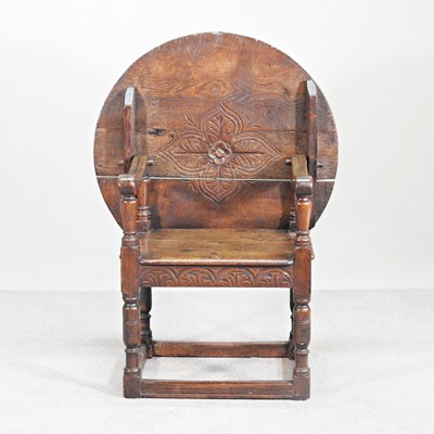 Lot 274 - An early 20th century oak monks' bench, with a...
