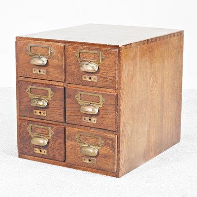 Lot 59 - An early 20th century small oak filing chest,...