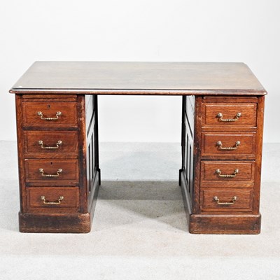 Lot 490 - An early 20th century oak twin pedestal desk,...