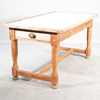 Lot 627 - A pine kitchen table, with an inset enamel top,...