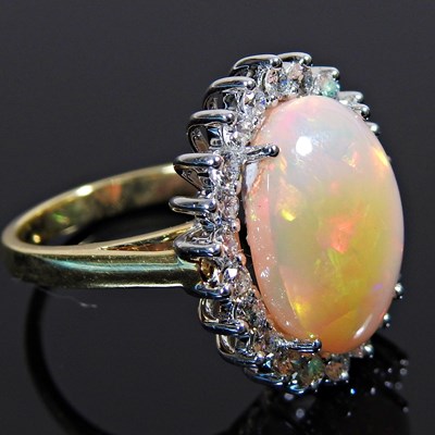 Lot 20 - A large 18 carat gold opal and diamond cluster...